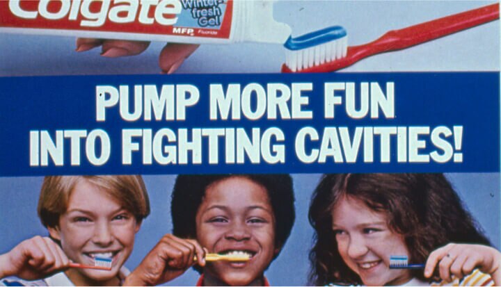 Ad from the 1960s for Colgate toothpaste showing three children holding toothbrushes, with text reading "Pump More Fun Into Fighting Cavities".